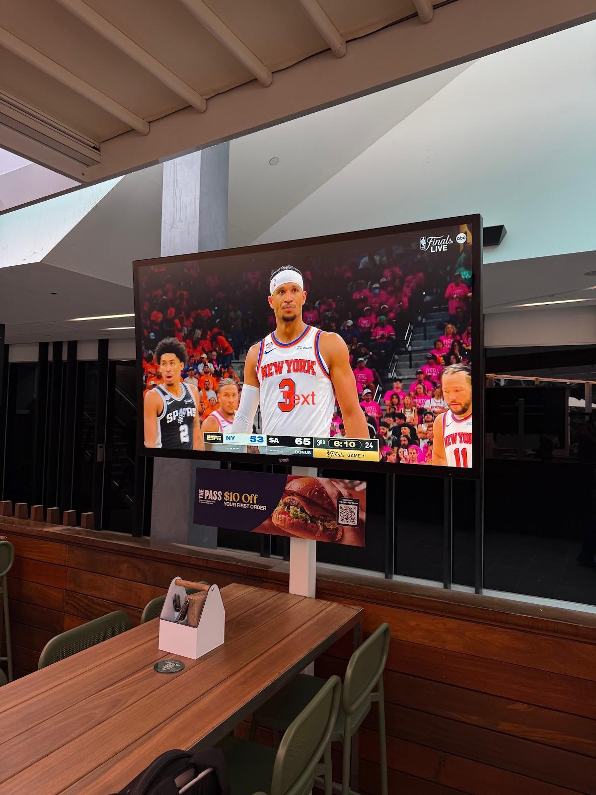 Spark Element Pro 75 inch outdoor TV showing basketball on the Good Nature Hotel terrace